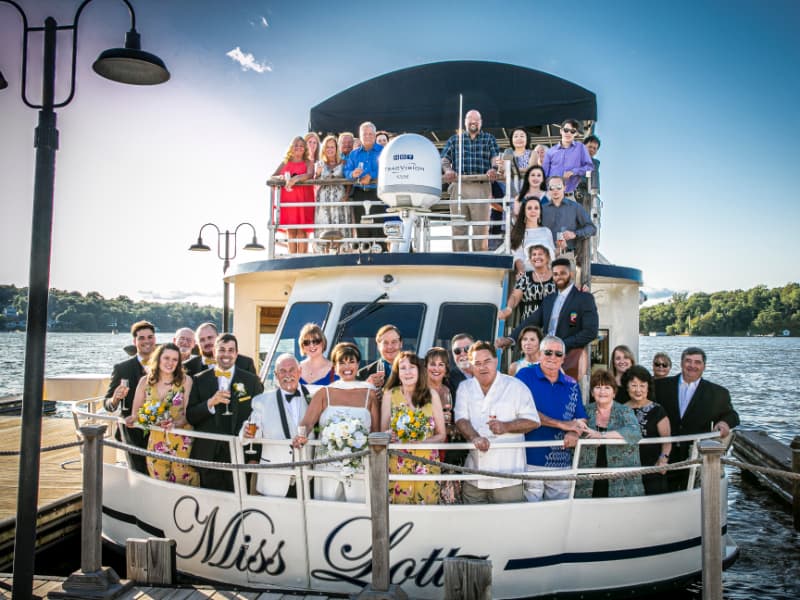 Wedding party smiling aboard Miss Lotta