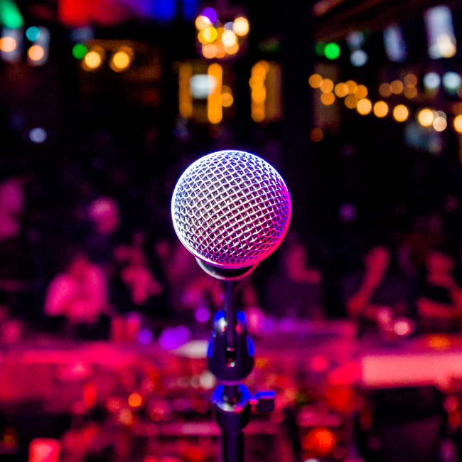 A mic in front of a colorful background